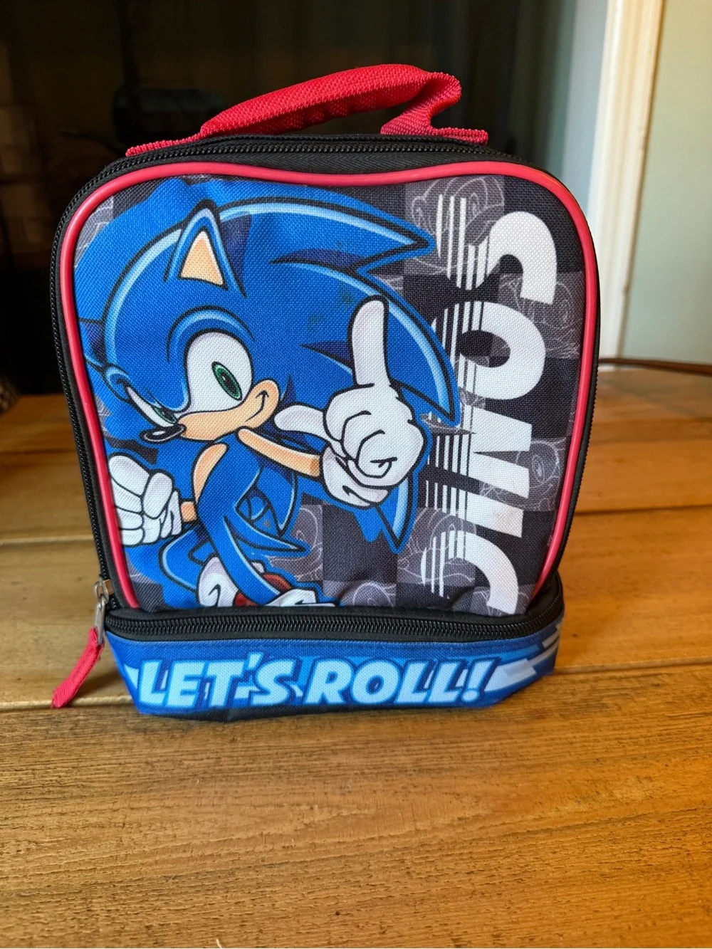 Blue & Red Kids Character Lunch Bag with 'Let's Roll' Graphic